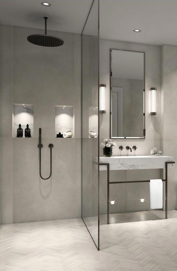 moderne beton cire badkamer met grijze visgraad badkamertegels