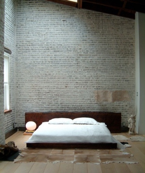 grijze stenen muur in moderne slaapkamer 